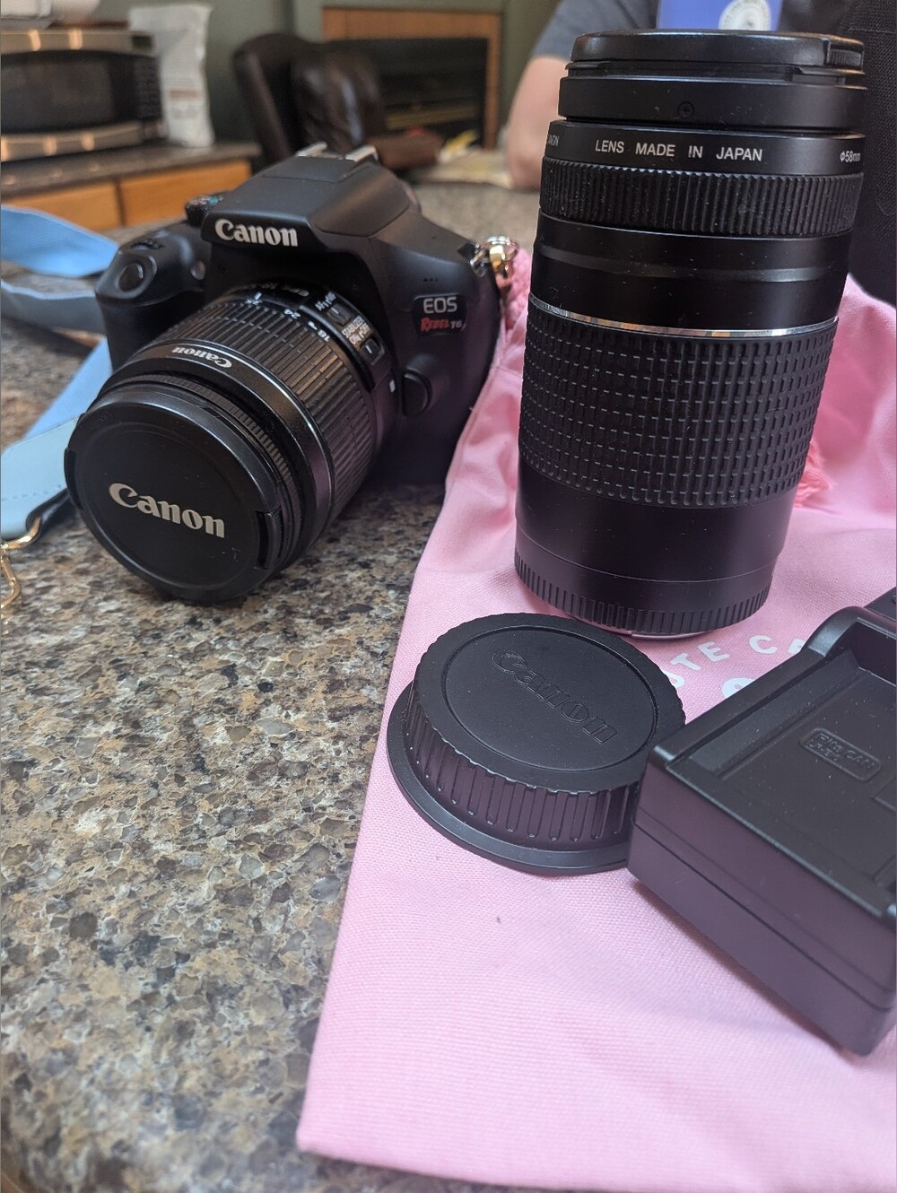 Canon DSLR Camera with Interchangeable Lenses in Black Accent
